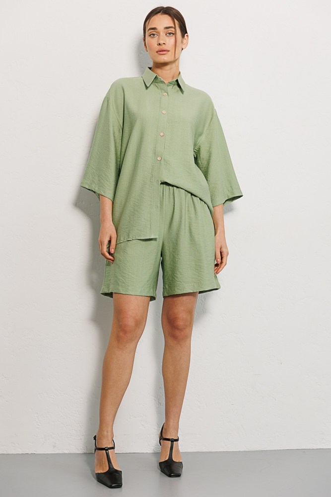 Купить салатовый женский летний костюм - фото